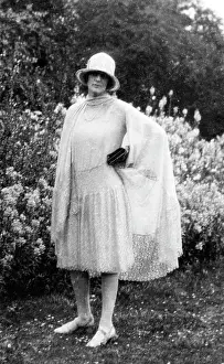 Flappers: Fashionable lady posing in garden