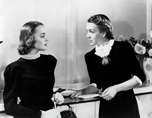 Saleswomen: Two Fashionable Women Talking
