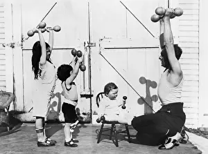 Workouts: Father and his three children having a workout with