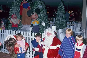Besley: Father Christmas with children in his grotto
