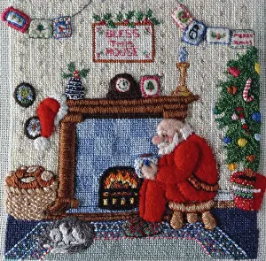 Fireside: Father Christmas sitting by his fireside