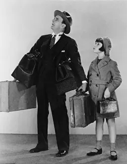 Fedora: Father and daughter with luggage