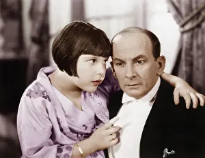 Poise: Father and daughter talking to each other in a living room