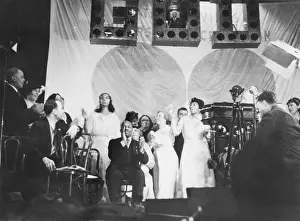 Utopian: Father Divine leading the singing at one of his