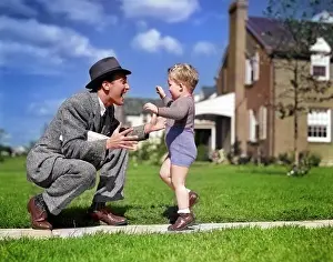 Businesspeople: Father Greeting Son Running Towards Him