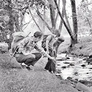 Backpacks: Father Hiking with Two Sons Wearing Backpacks