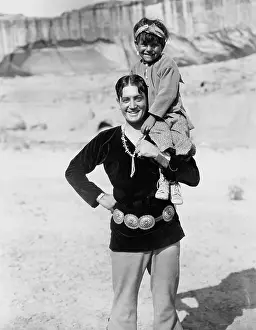 Minorities: Father lifting son on shoulder