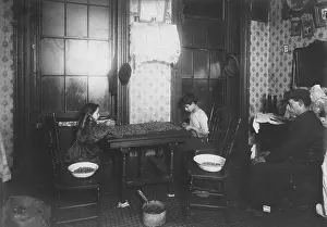 Laight: Father loafs while children work, caption: ?