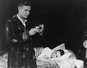 Teenaged: Father preparing medicine for sick son