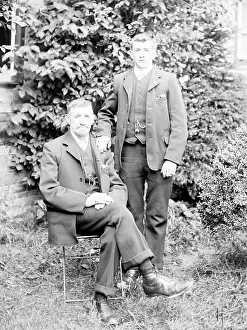 Turnups: Father and son in a garden, Mid Wales