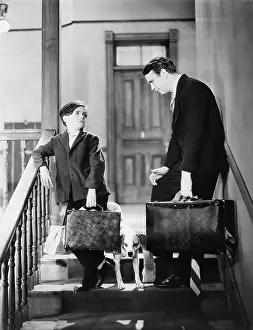 Disappointing: Father and son travelling with suitcases