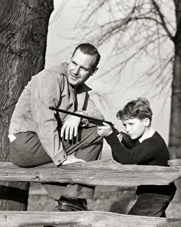 Marksmanship: Father Teaching Son Firearm Safety