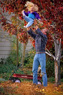 Brisk: Father Throwing Laughing Blond Daughter Looking