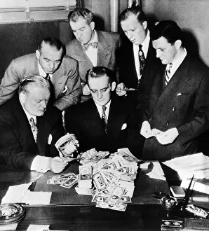 Counterfeit: Federal and State men looking at part of ?