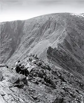 Helvellyn: Fell walkers on Striding Edge leading to Helvellyn, Lake Dis