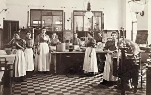 Femal: Eight femal cooks in a canteen kitchen