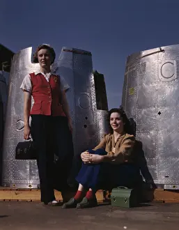 Packed: Two female assembly line workers enjoy a lunch