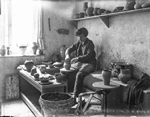 Ceramist: Female ceramist in ceramics workshop