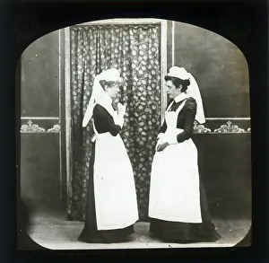Alex Lambert Lantern Slide Collection: Two female domestic servants in discussion
