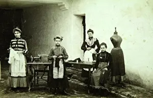 Handicrafter: Four female employees of a tailor shop in