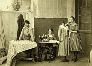 Handicrafter: Three female employees of a tailor in a Viennese