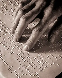 Braille: Female Hand Reading Braille