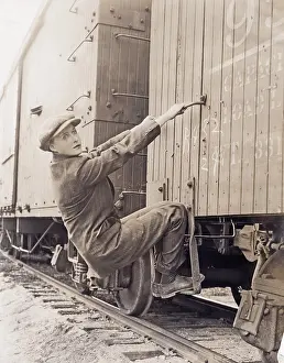 Evading: Female hobo climbing freight train