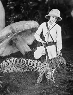 Coldness: Female hunter with dead leopard