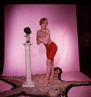 Robin Adler: Female model on bear rug in studio portrait