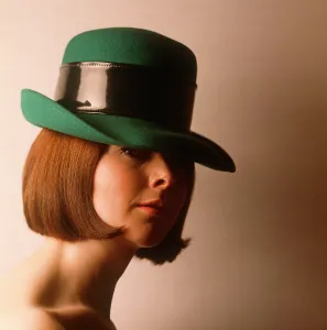 Angular: Female model with green hat and stylish bob