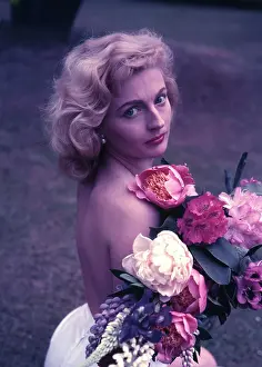 Robin Adler: Female model holding flowers