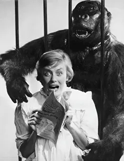Robin Adler: Female model with magazine and gorilla