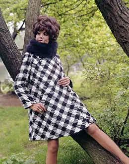 Coiffured: Female model in Mary Quant style coat