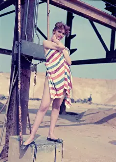 Robin Adler: Female model posing with stripy towel