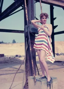 Robin Adler: Female model posing with stripy towel