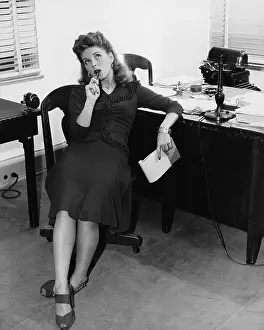 Secretarial: Female office worker in thought
