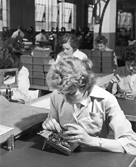 Assembles: Female Production Line Worker