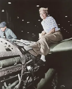 Rosie: A female riveter working on the fabrication of an airplane