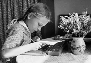 Homework: Female student doing her homework, 1941