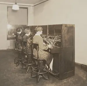 Investments: Three female telephone switchboard operators in