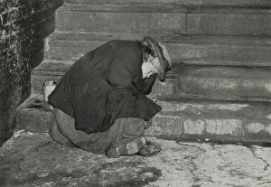 Recession: Female tramp asleep on steps, London