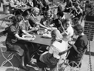 Maternity: Female workers of a munitions factory during the lunch break