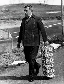 Operettas: Fernandel, French comedian, carrying a present