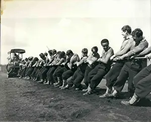 Backward: Field gun crew at H.M.S drake take on a ten