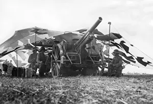 Leichte: Field howitzer in camouflaged position, 1936