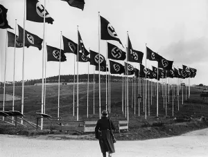 Guarded: Field with swastika flags