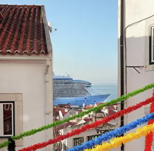 Tagus: Fiesta streamers and cruise ship, Alfama district