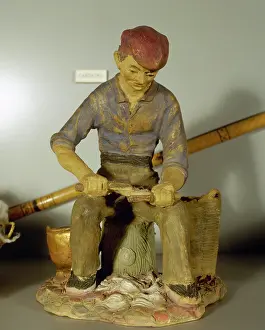 Fibre: Figurine depicting a carder