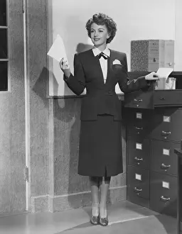 Businesswoman: Filing away