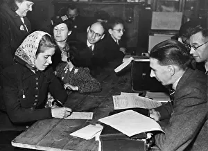 Distributing: Filling in Food ration card WWII